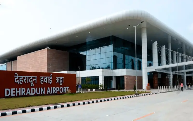 Dehradun airport taxi service at Jolly Grant Airport entrance with modern terminal building